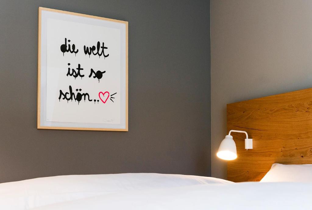 Postel nebo postele na pokoji v ubytování Hotel Die Alm