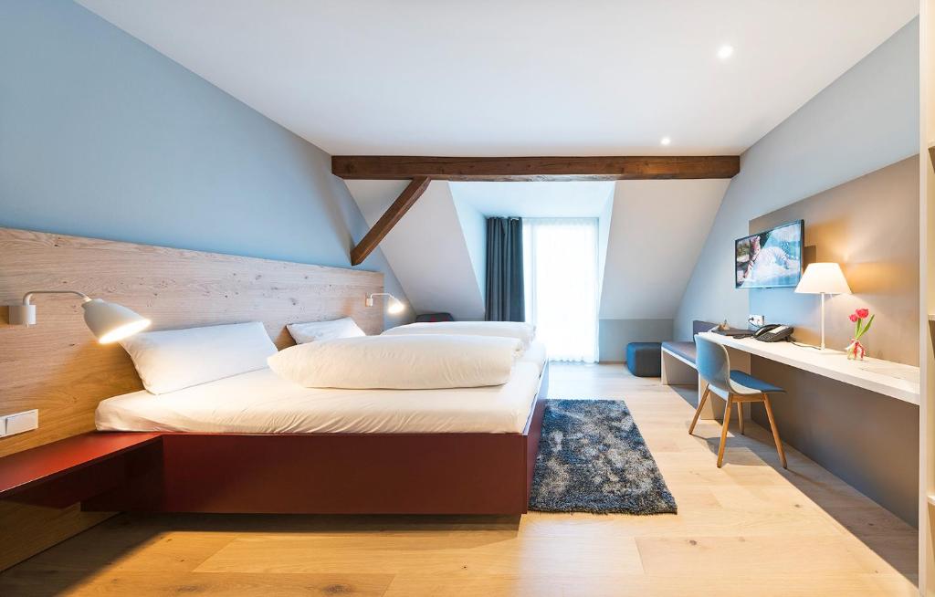 Postel nebo postele na pokoji v ubytování Hotel Die Alm