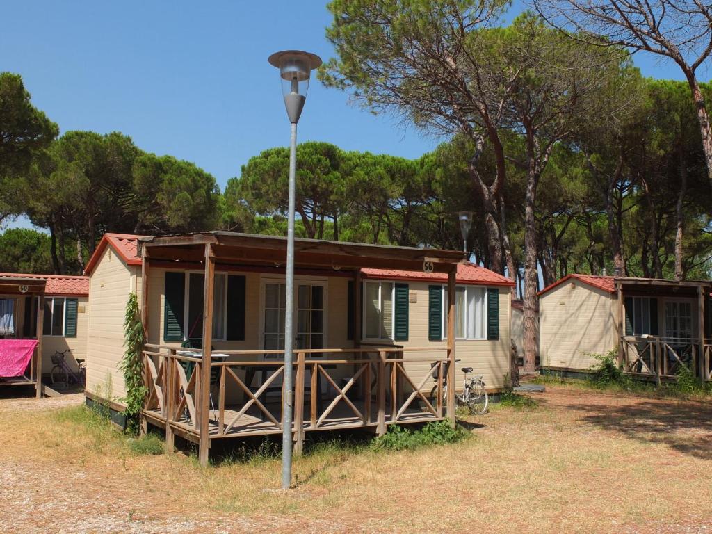a house with a light pole in front of it at Mobile Home in Cesenatico by Adriatic Sea in Cesenatico