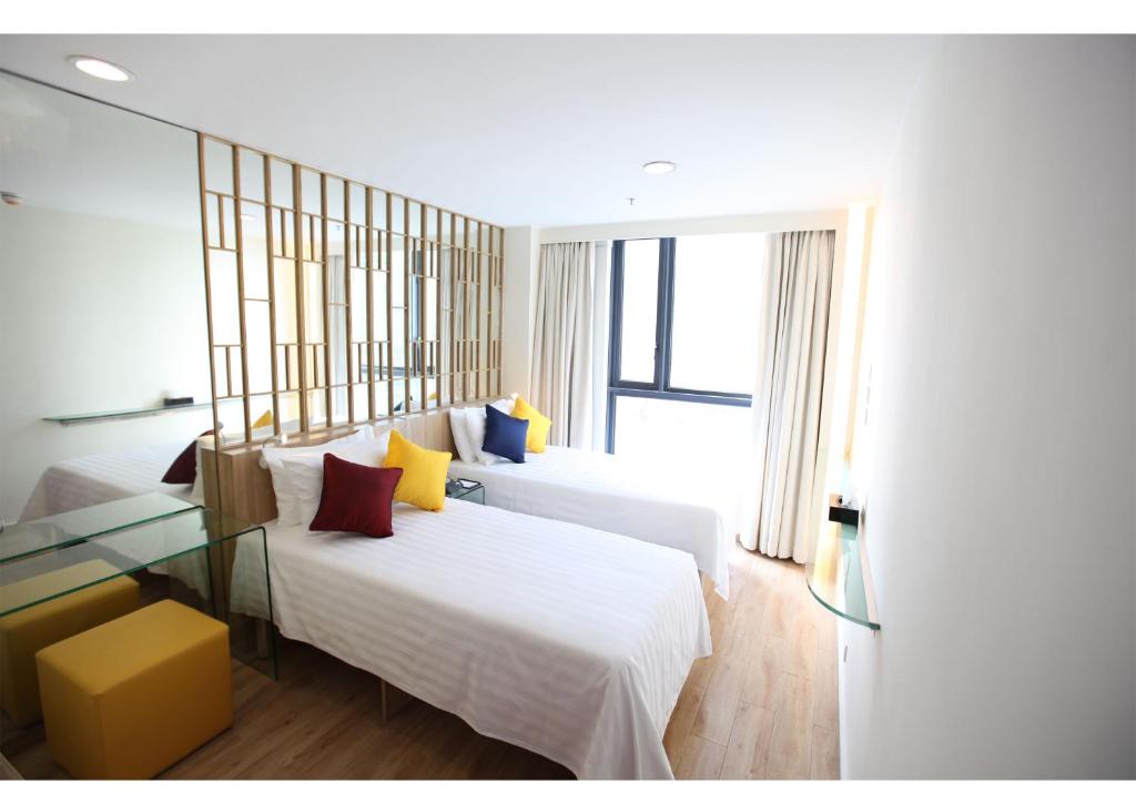 Voodi või voodid majutusasutuse IW Hotel toas