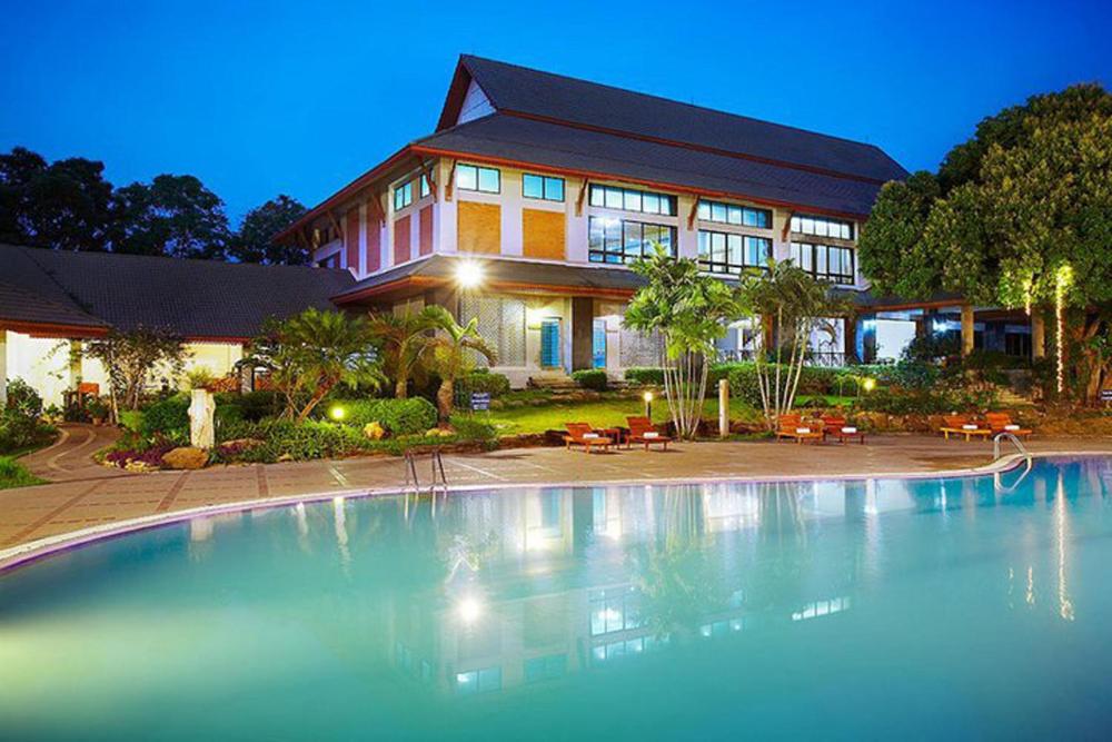 a large swimming pool in front of a house at Muaklek Paradise Resort in Ban Muak Lek