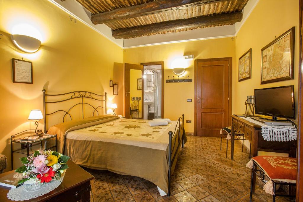 Televízia a/alebo spoločenská miestnosť v ubytovaní B&B L'Alloggio Dei Vassalli
