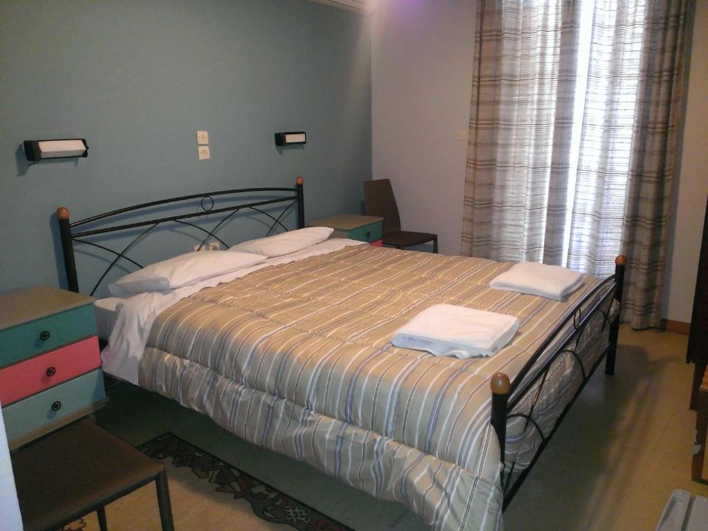 A bed or beds in a room at Artemis