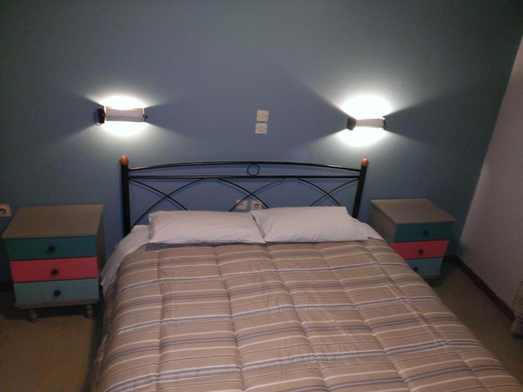 A bed or beds in a room at Artemis
