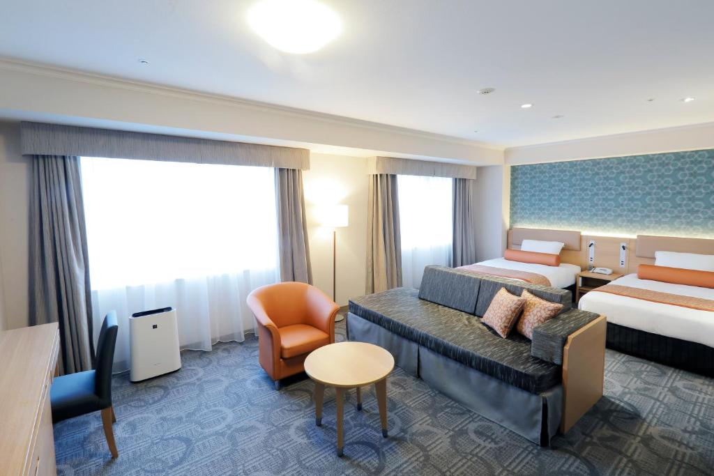 Postel nebo postele na pokoji v ubytování Sapporo Excel Hotel Tokyu