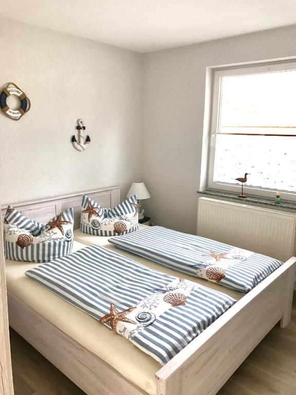 Postel nebo postele na pokoji v ubytování Ferienhaus Sellin