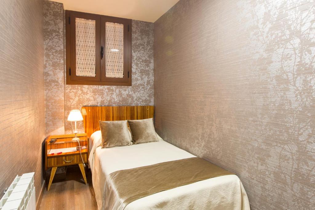 Postel nebo postele na pokoji v ubytování Hotel Villa San Jorge