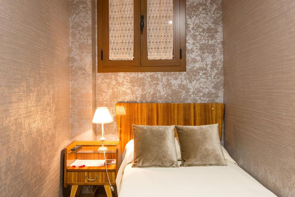 Postel nebo postele na pokoji v ubytování Hotel Villa San Jorge