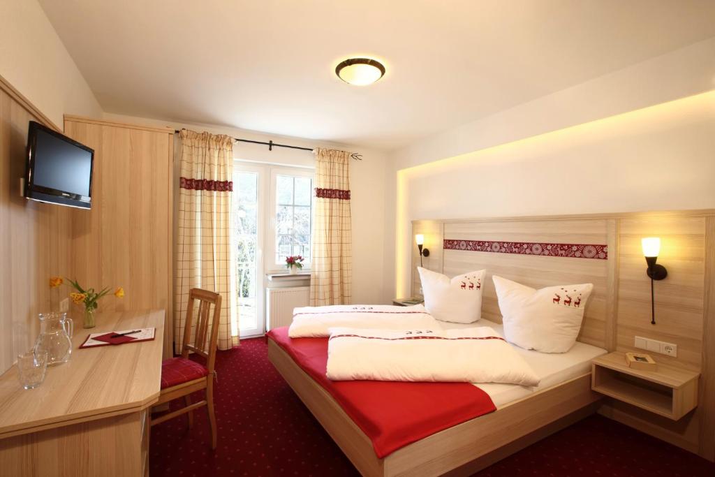 Postel nebo postele na pokoji v ubytování Hotel Garni Dorfkammer