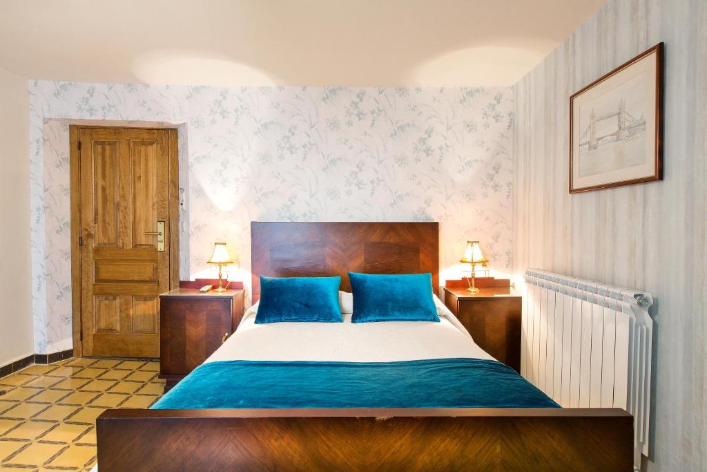 Postel nebo postele na pokoji v ubytování Hotel Villa San Jorge