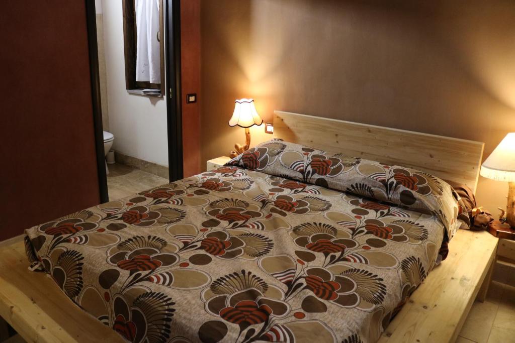 Postel nebo postele na pokoji v ubytování Casa Mattia - B&B in Legno & Paglia
