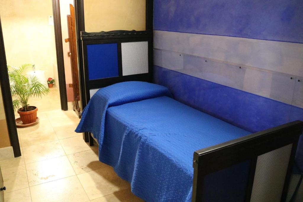 Postel nebo postele na pokoji v ubytování Casa Mattia - B&B in Legno & Paglia