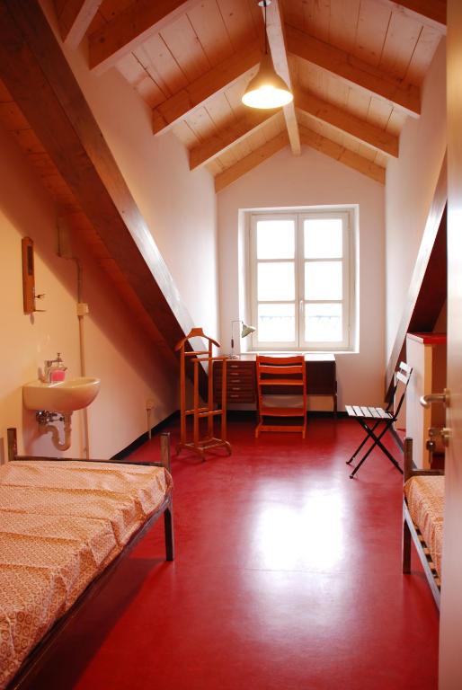 Posteľ alebo postele v izbe v ubytovaní Attic Hostel Torino