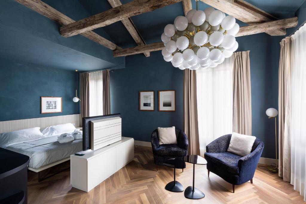 Postel nebo postele na pokoji v ubytování Liassidi Wellness Suites