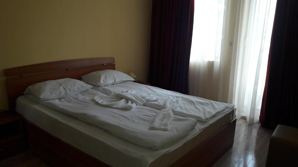 Postel nebo postele na pokoji v ubytování Victoria Perla Apartment