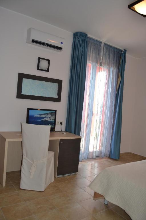 Posteľ alebo postele v izbe v ubytovaní Hotel La Siesta