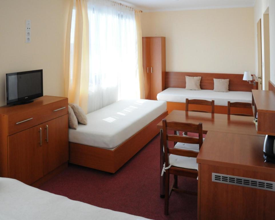 Postel nebo postele na pokoji v ubytování Penzion Panorama