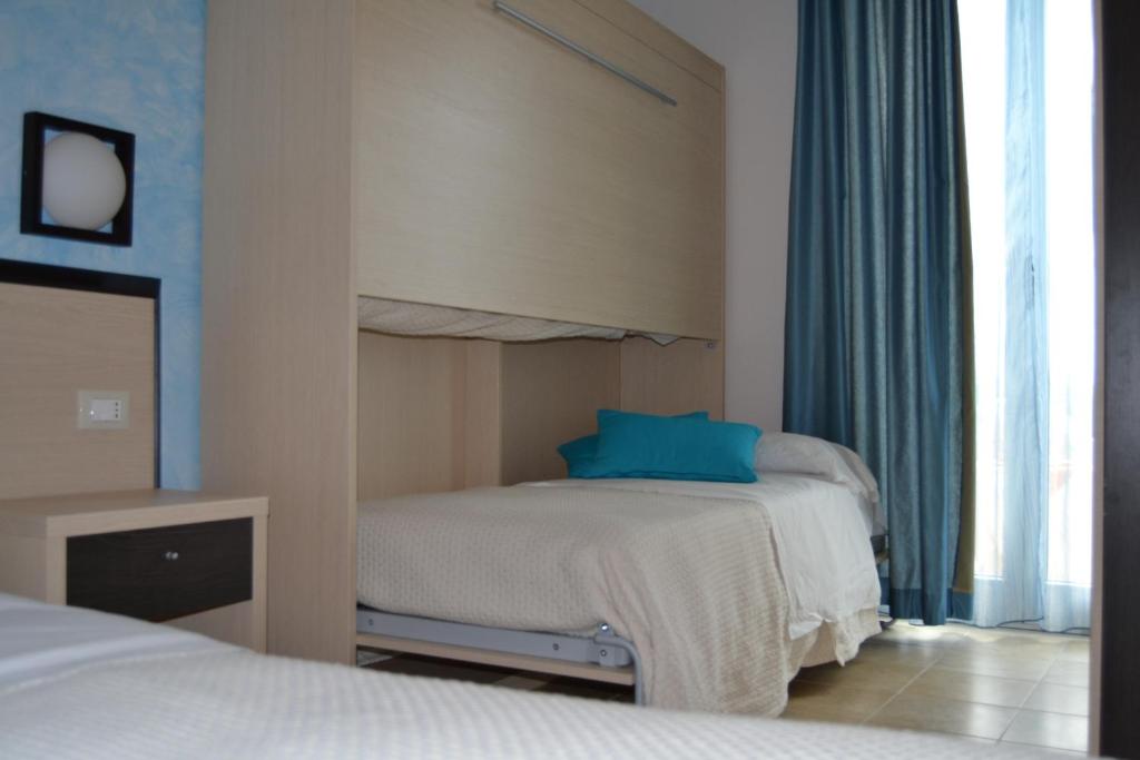 Posteľ alebo postele v izbe v ubytovaní Hotel La Siesta