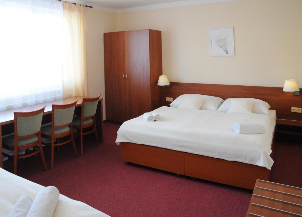 Postel nebo postele na pokoji v ubytování Penzion Panorama