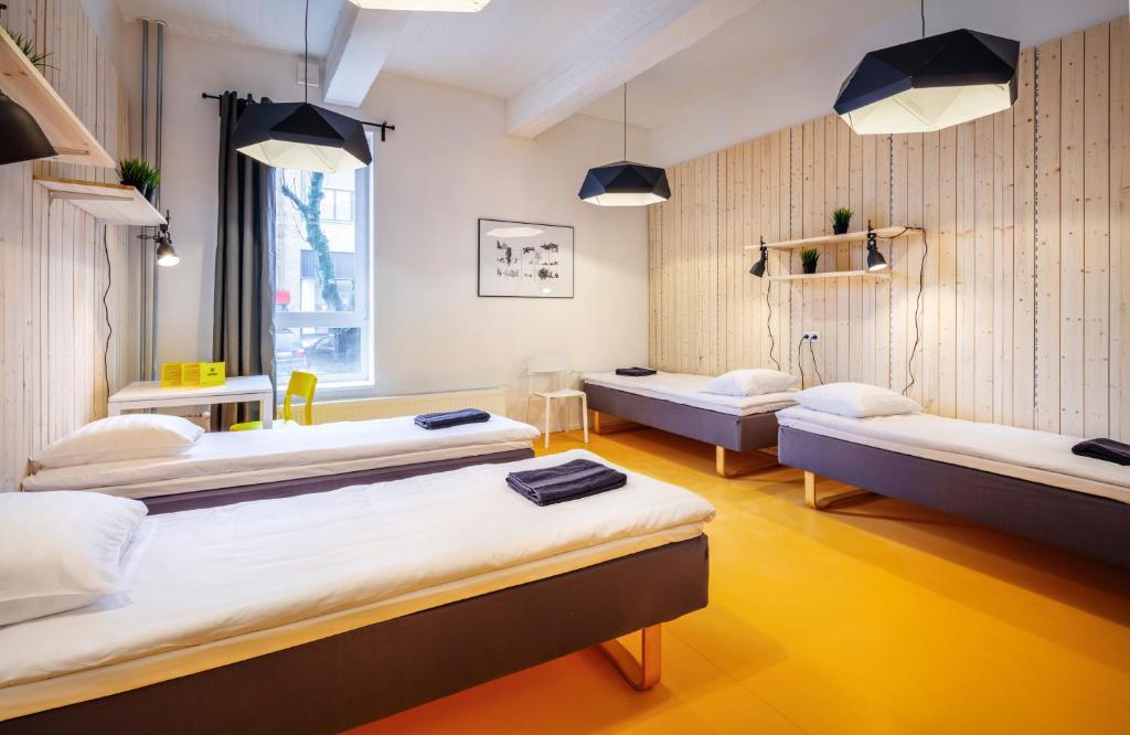 Voodi või voodid majutusasutuse Hektor Design Hostel toas