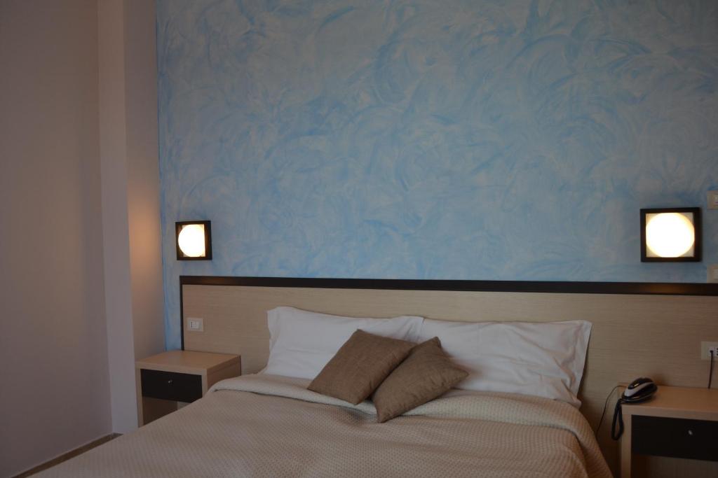 Posteľ alebo postele v izbe v ubytovaní Hotel La Siesta