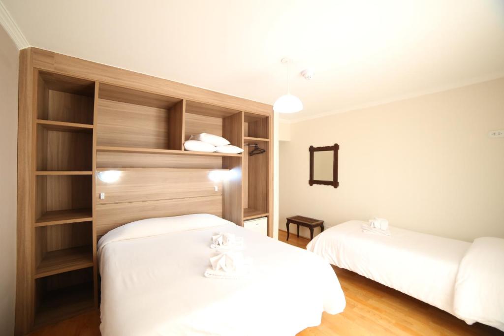 Uma cama ou camas num quarto em Hotel JB