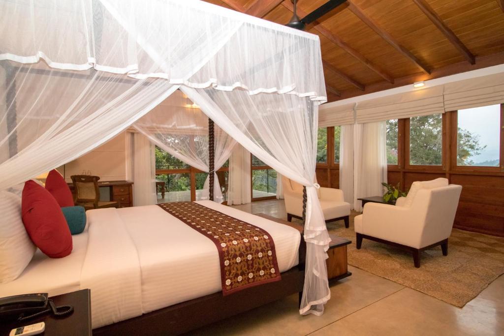 Postel nebo postele na pokoji v ubytování Kings Pavilion Luxury Hotel