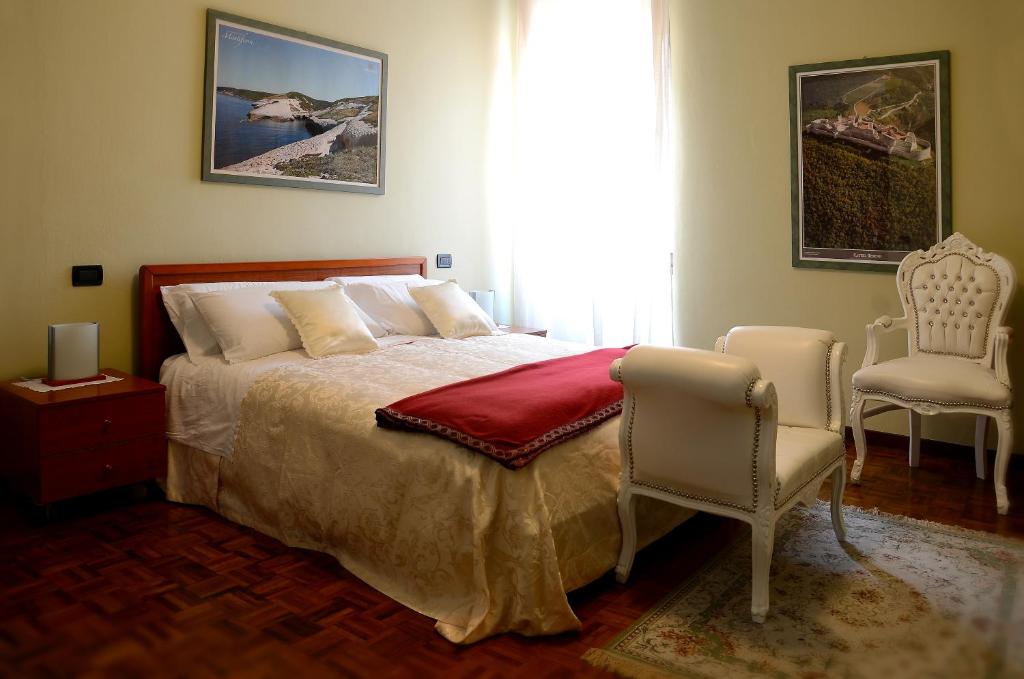 Postel nebo postele na pokoji v ubytování Hotel La Fenice