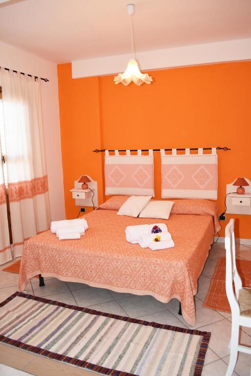 Postel nebo postele na pokoji v ubytování Casa Vacanza Porto Frailis già Porto Frailis B&B