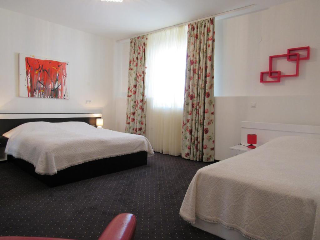 Postel nebo postele na pokoji v ubytování Guest House Klaudija