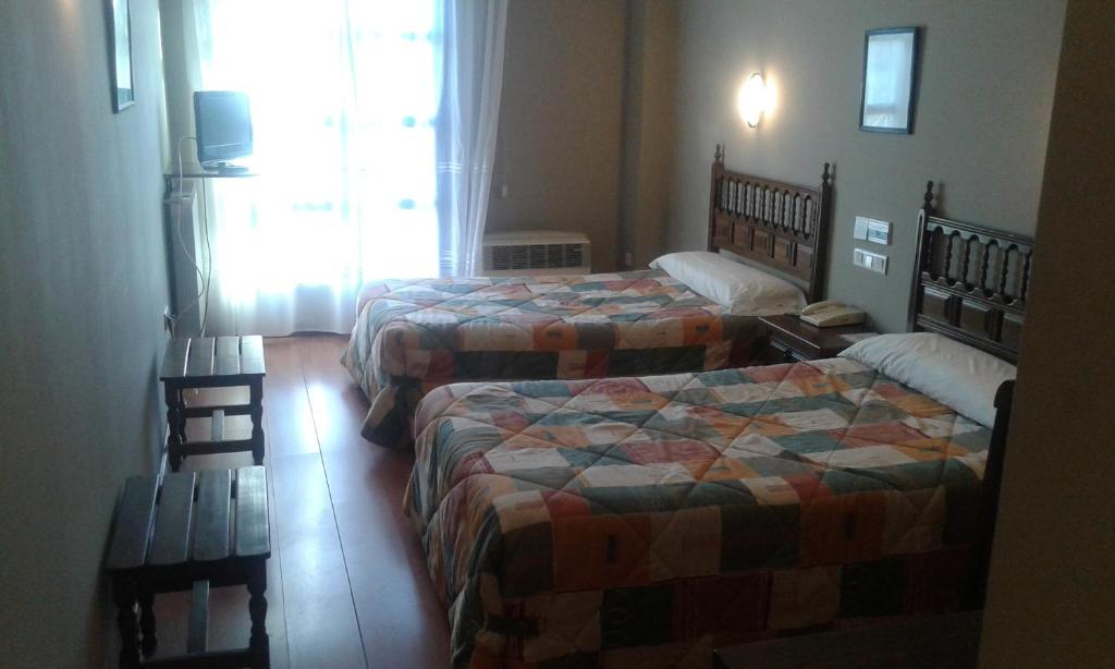 Postel nebo postele na pokoji v ubytování Hotel Casa Aurelia