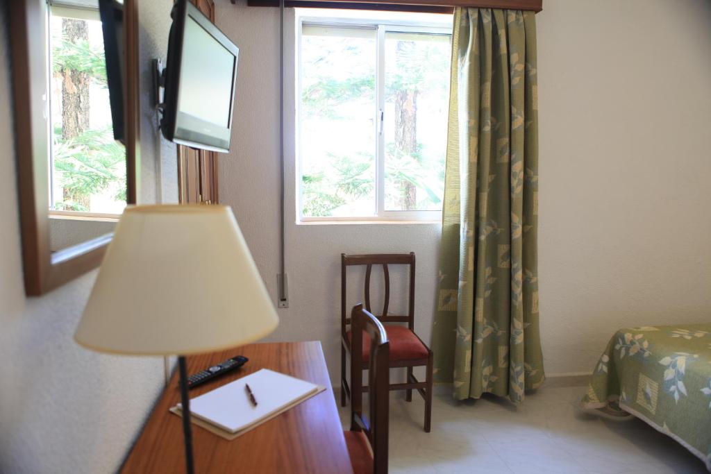 TV a/nebo společenská místnost v ubytování Hotel El Coloso