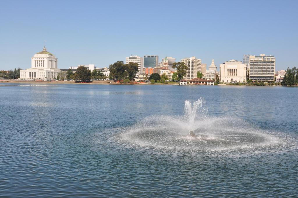 a fountain in the middle of a body of water at Americas Best Value Inn - Downtown Oakland/Lake Merritt in Oakland