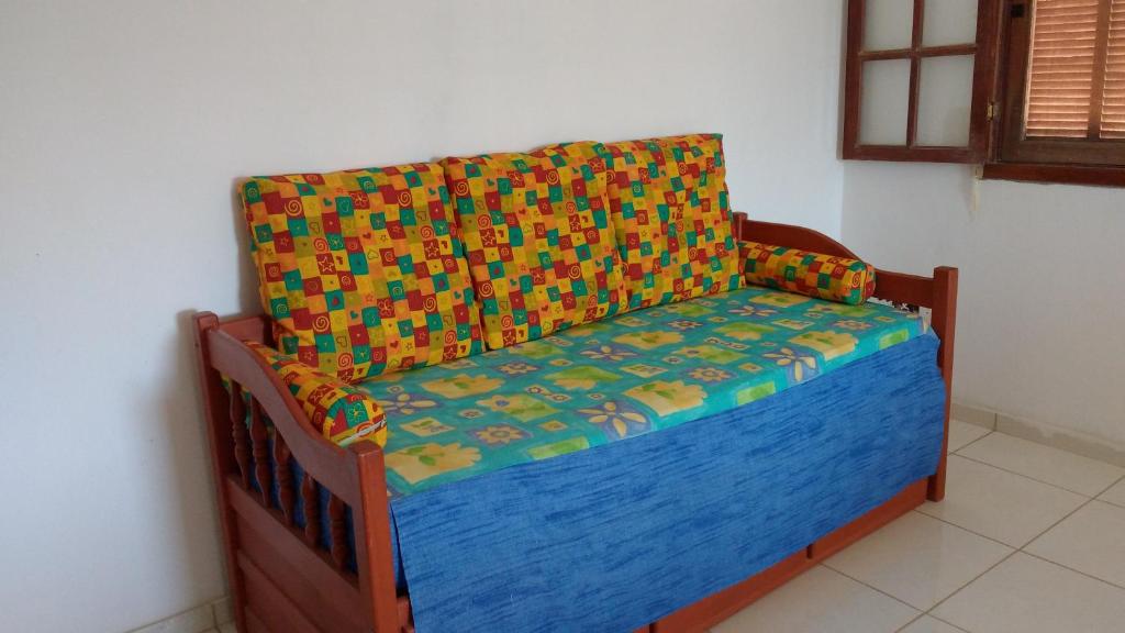 En eller flere senge i et værelse på Casa Saquarema