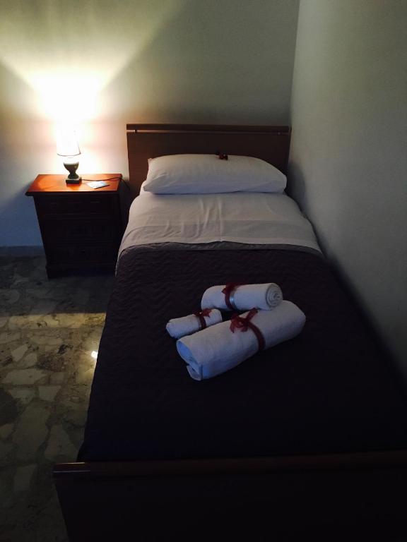 Postel nebo postele na pokoji v ubytování B&B Lo Scrigno