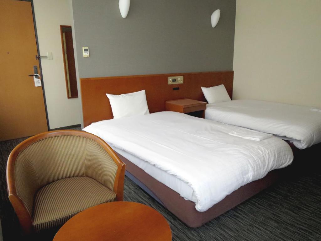 Postel nebo postele na pokoji v ubytování Sun Palace Hotel