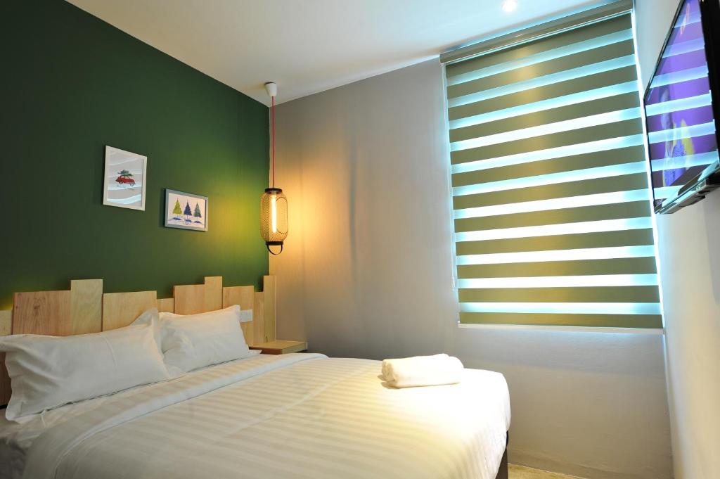 Postel nebo postele na pokoji v ubytování Finess Basic Hotel