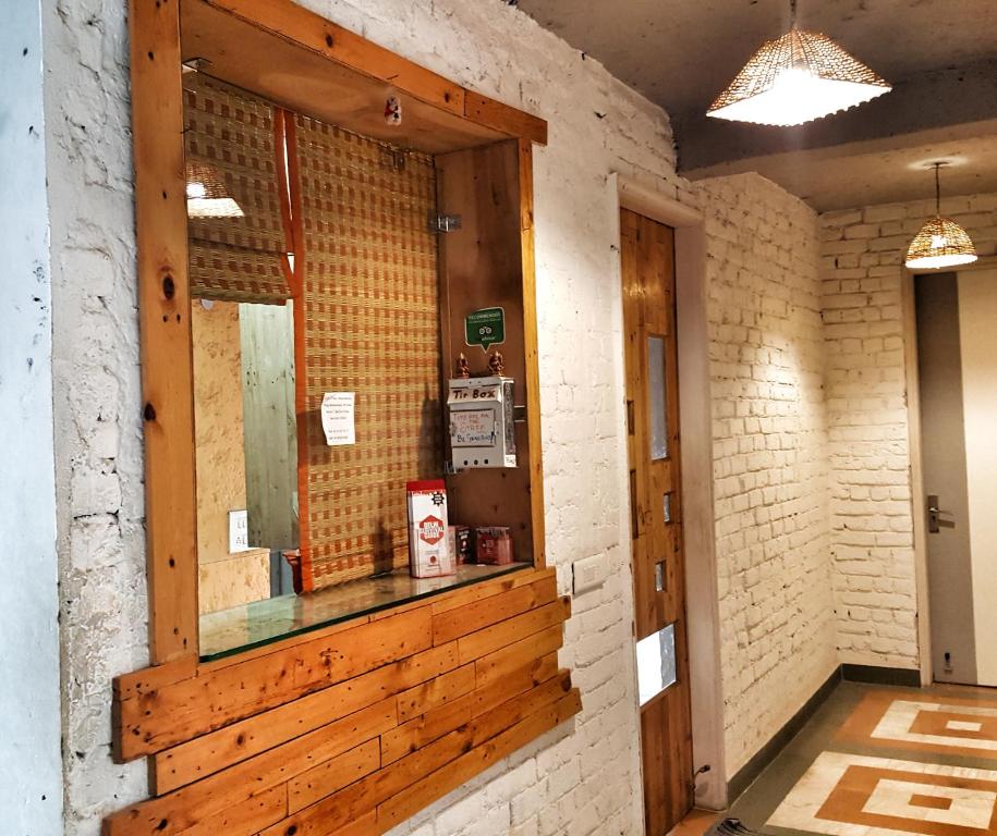 a mirror on a wall in a room at JHouse near Bhikaji in New Delhi