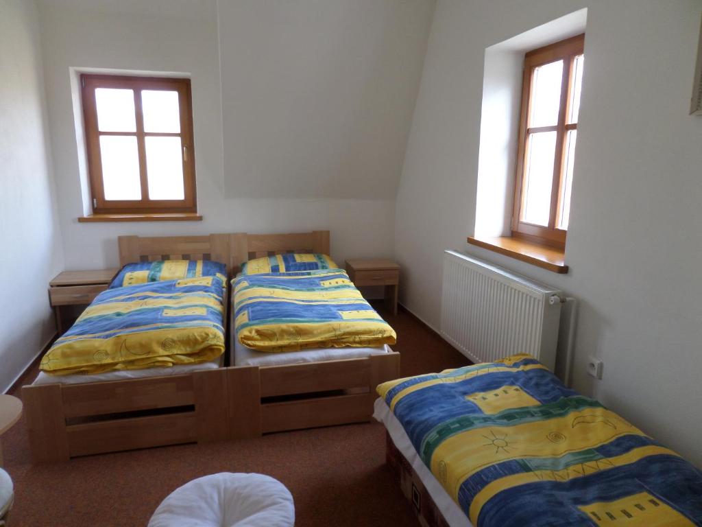 Postel nebo postele na pokoji v ubytování Kralicka Chata