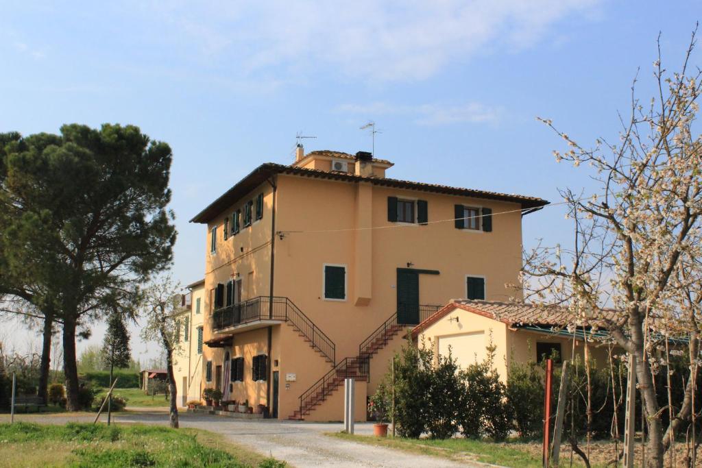 a large building with stairs on the side of it at Casa Tafi in Castelfiorentino