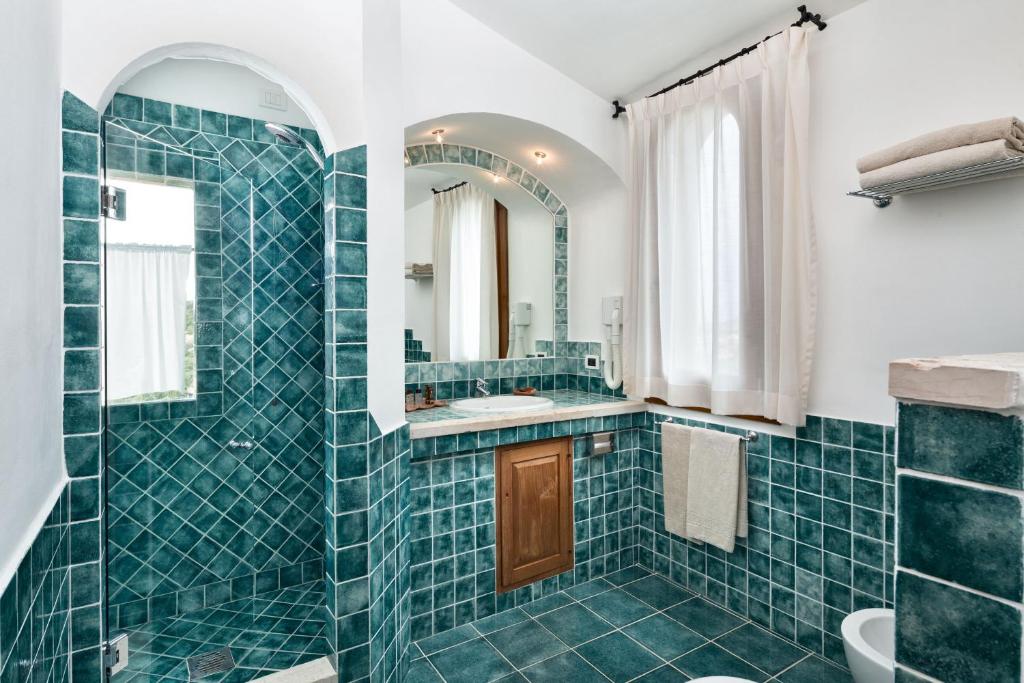 Koupelna v ubytování Hotel Arathena