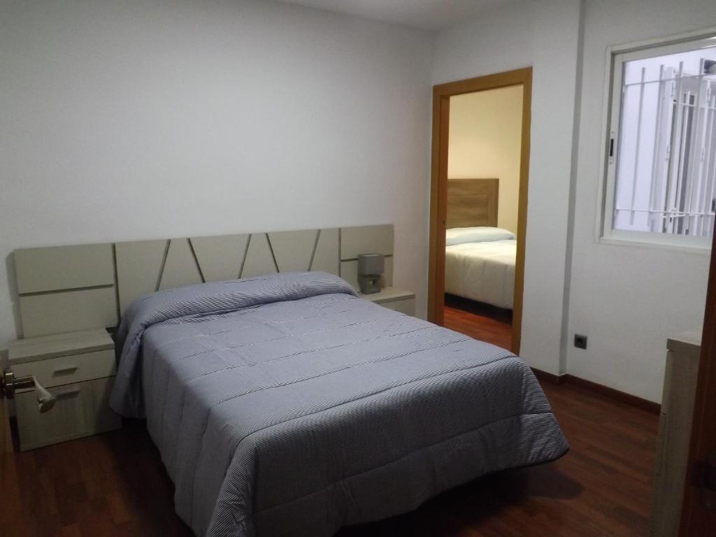 Posteľ alebo postele v izbe v ubytovaní Apartamento Completo Boquerón de Granada
