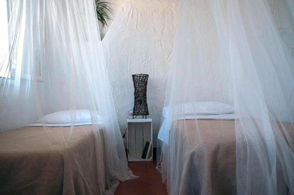A bed or beds in a room at Addumari