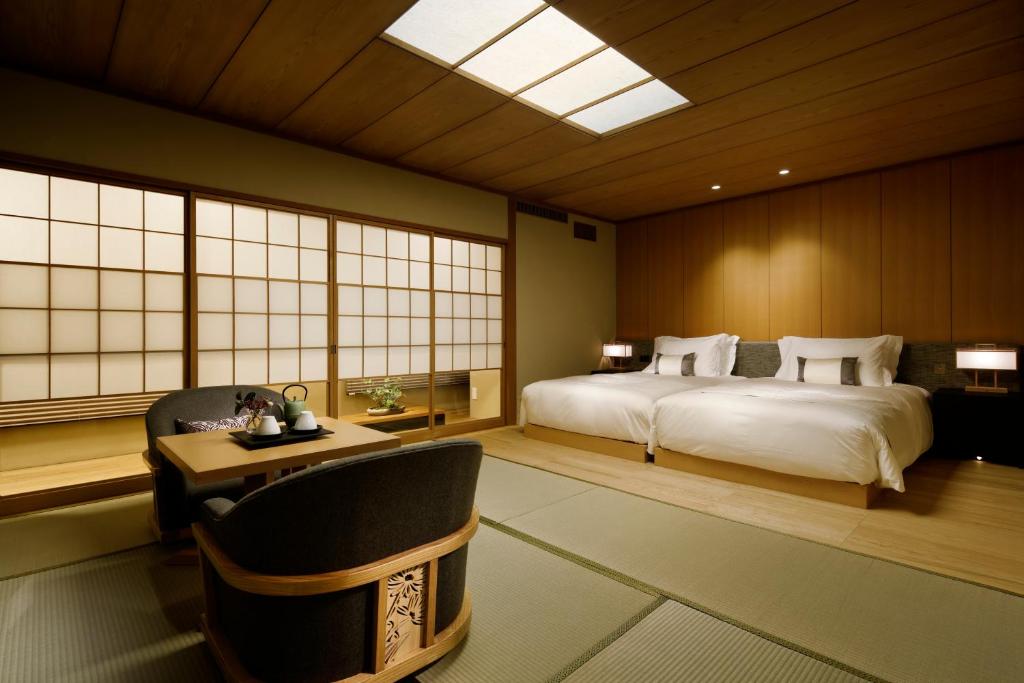 Postel nebo postele na pokoji v ubytování Takanawa Hanakohro - in Grand Prince Hotel Takanawa