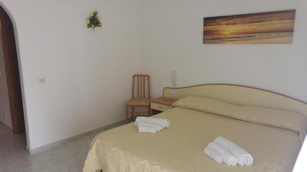 Postel nebo postele na pokoji v ubytování Villa Natalina