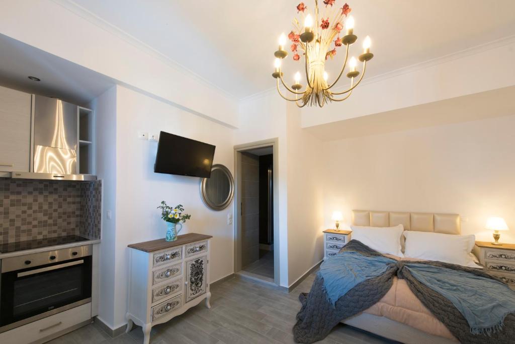 Postel nebo postele na pokoji v ubytování Rose Suites