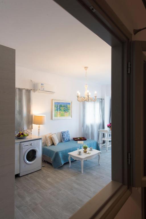 Postel nebo postele na pokoji v ubytování Rose Suites