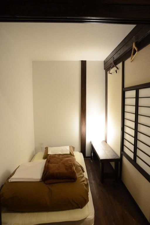 Postel nebo postele na pokoji v ubytování Guest House KuKu