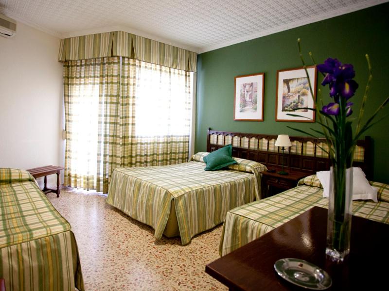 Postel nebo postele na pokoji v ubytování Hotel Costa