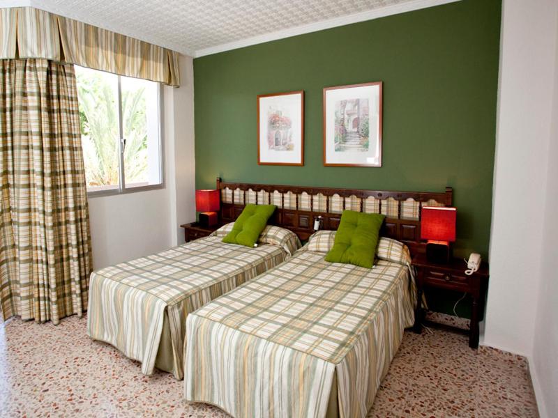 Postel nebo postele na pokoji v ubytování Hotel Costa